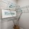 a white room with a white wall and a picture frame