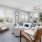 a living room with a white couch and a table