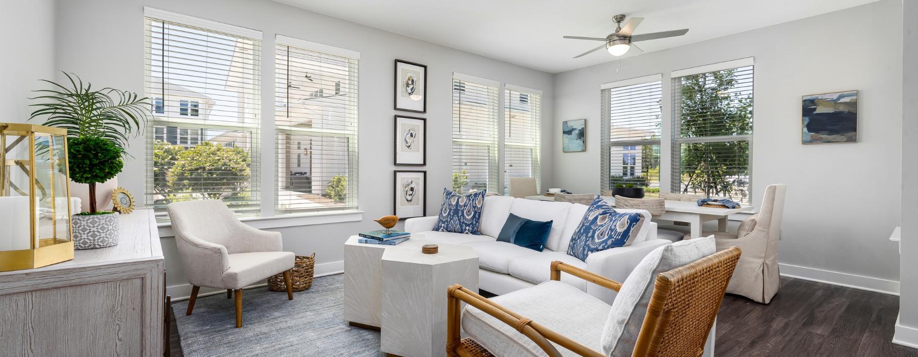 a living room with a white couch and a table