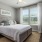 a bedroom with a bed and a fan