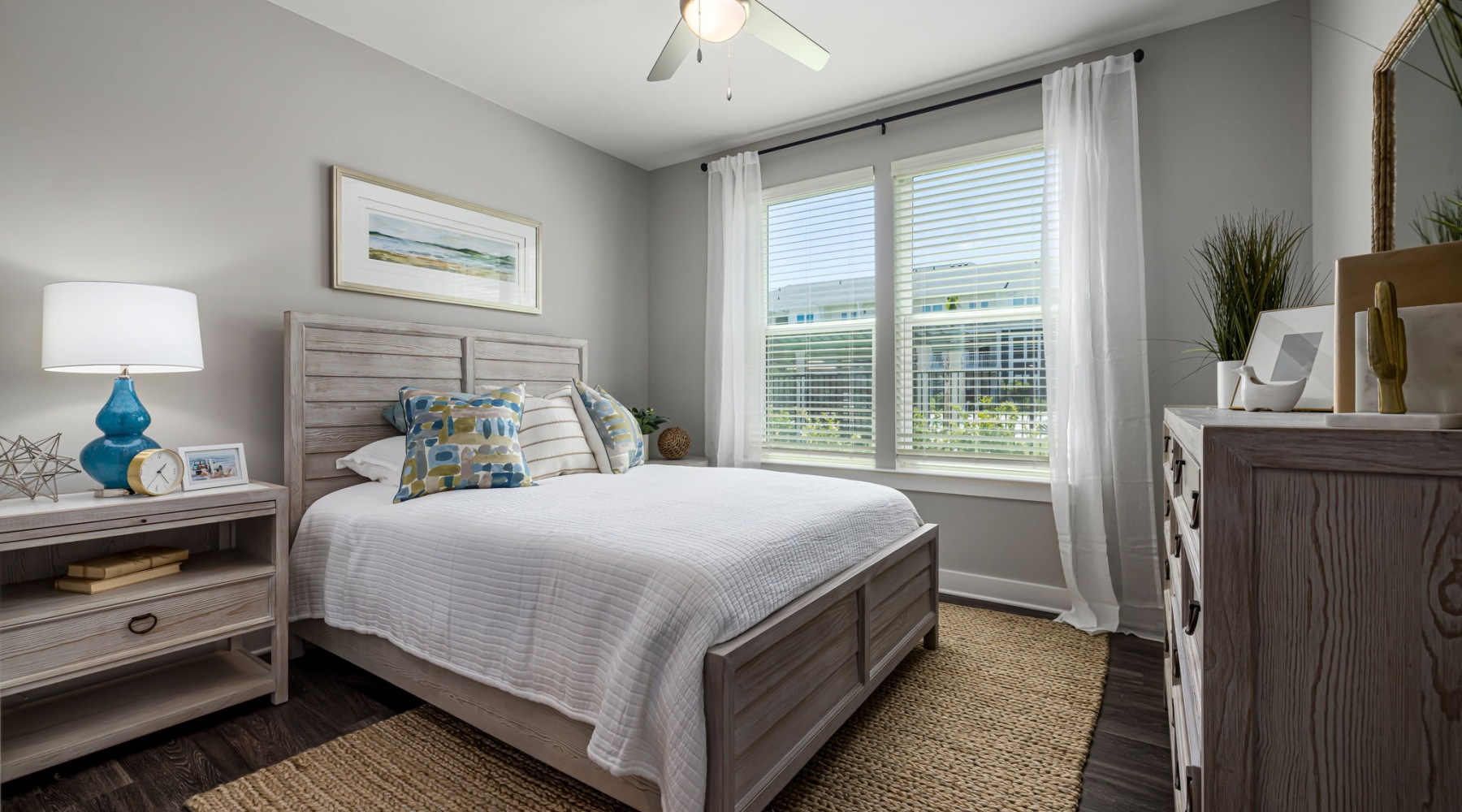Feel at home bedroom with a large window and modern decor